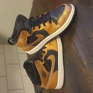 Boys 2.5 Gold and Black Nike Jordans
